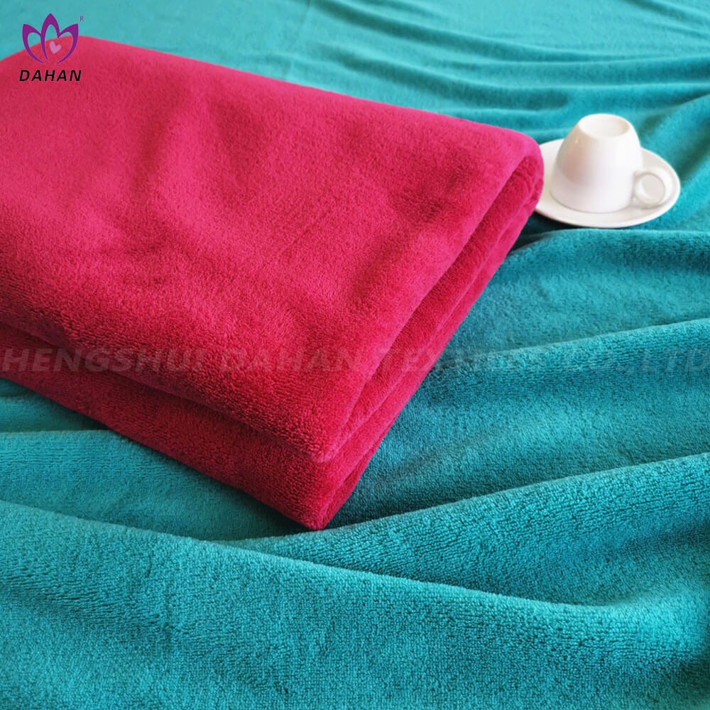 Solid color coral fleece blanket.