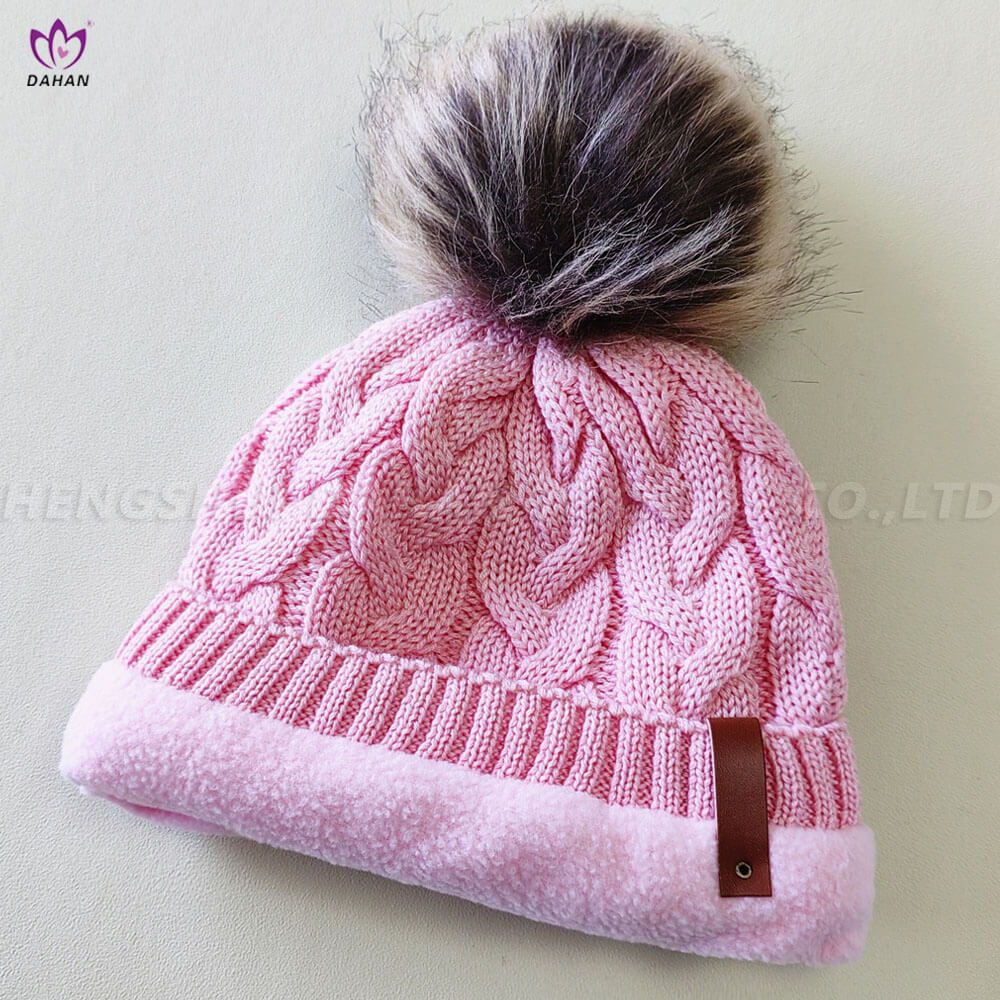 HA35 Knitted hat with wool ball.